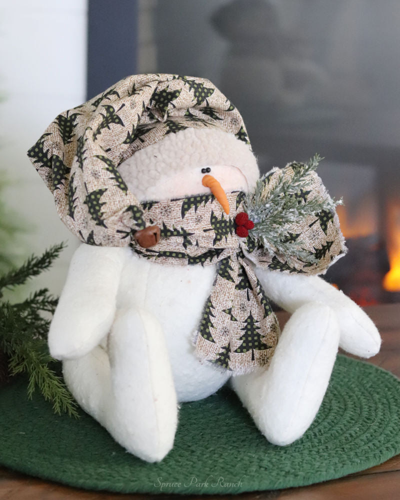 Sitting Snowman With Evergreen Themed Accessories